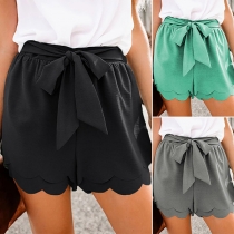 Sporty Solid Color Irregular Hemline Bow Tie Shorts
